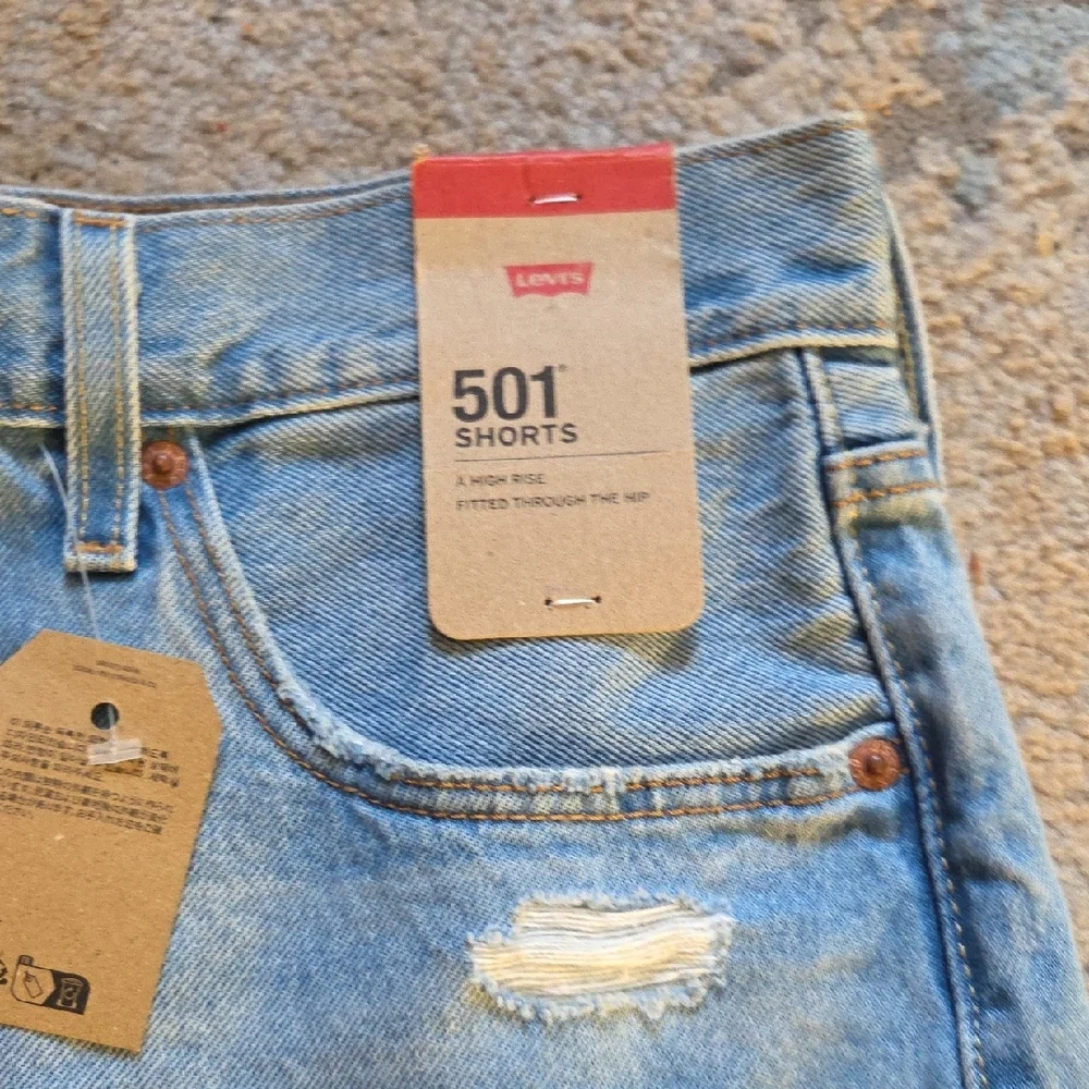 Levi's 501 Light Blue Distressed Jean Shorts‎